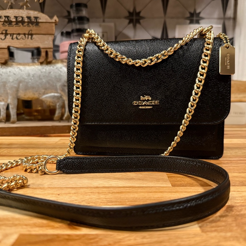 Coach Mini Klare Black Crossbody Bag with Gold Chain.